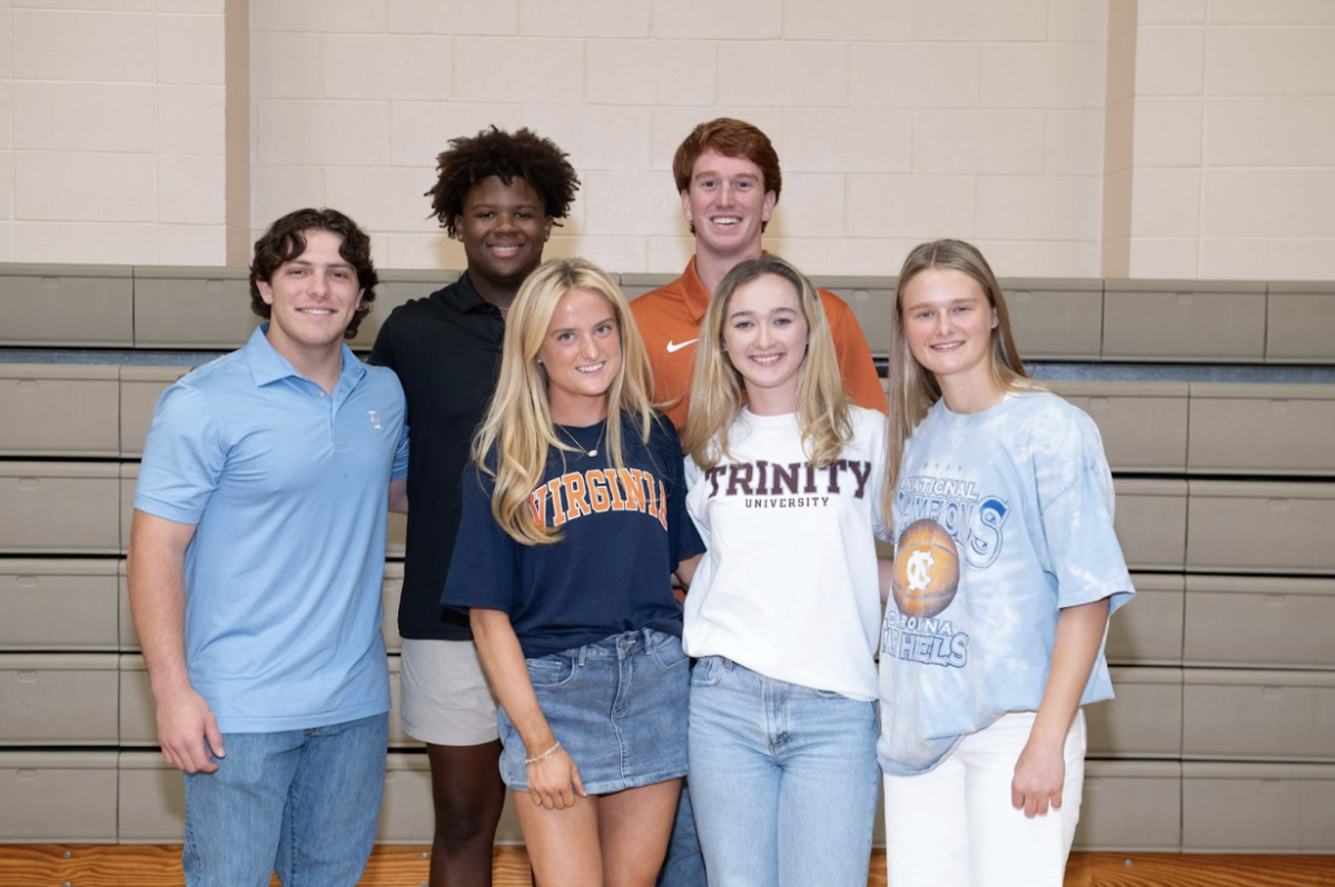 Seniors Marcus Harris, Jack Paris, Landon Layhew, Caroline Raynes, Emily Camp, and Merrit Scubitz come together to celebrate their signings of letters of intent to play for different colleges. 